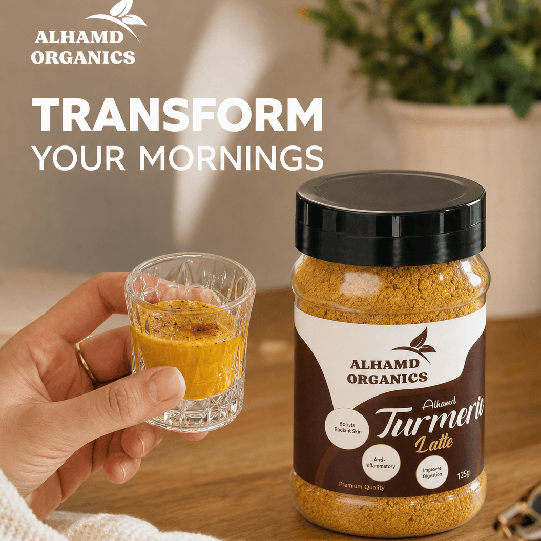 AlhAMD Organics Turmeric Latte jar with a glass of latte on a wooden surface, with 'Transform Your Mornings' text.