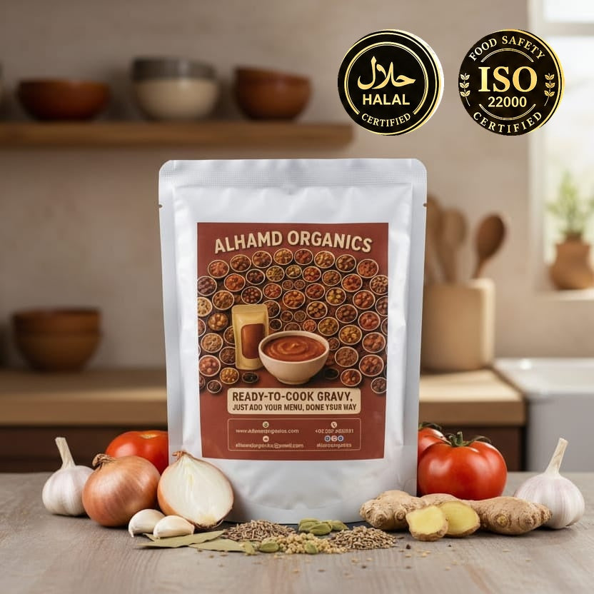Alhamd Organics ready-to-cook gravy package on a kitchen counter with ingredients and certification logos.