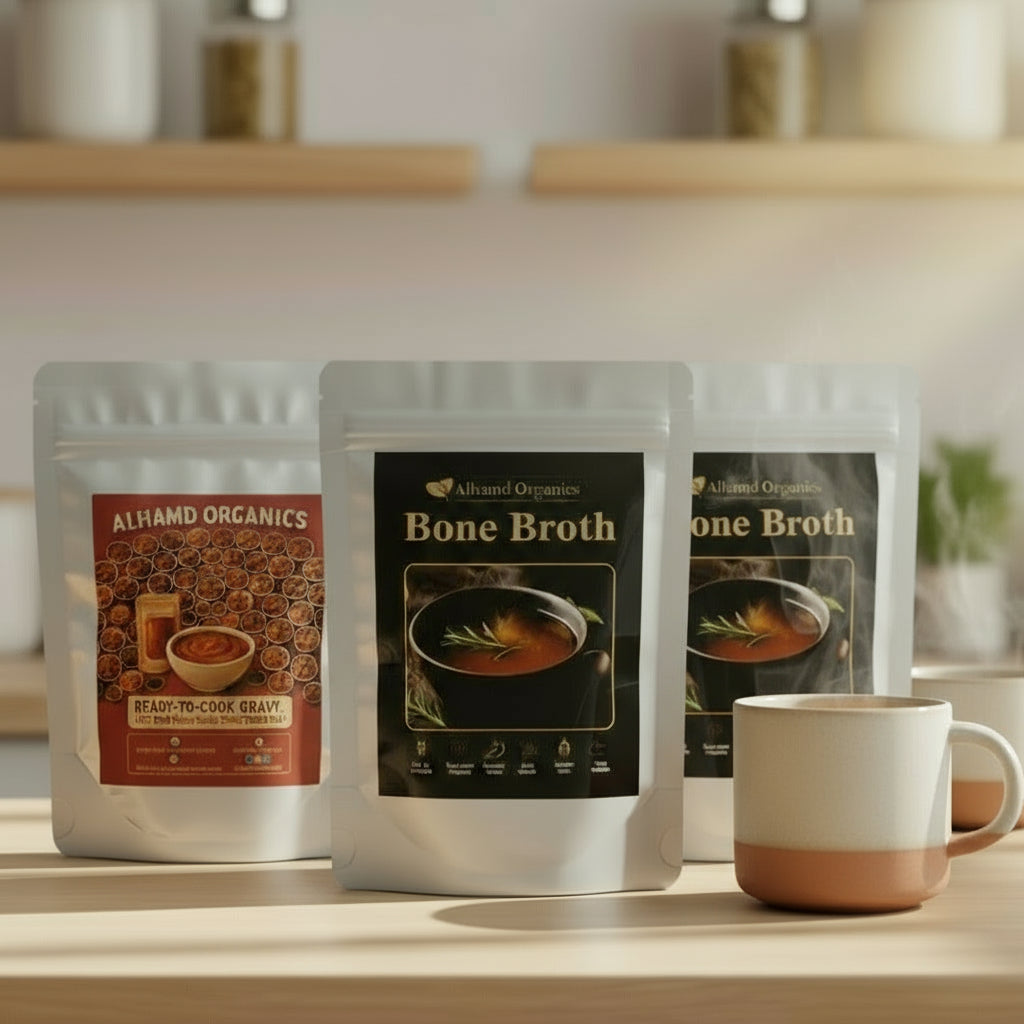 Almond Organics bone broth packages on a kitchen counter with a mug.