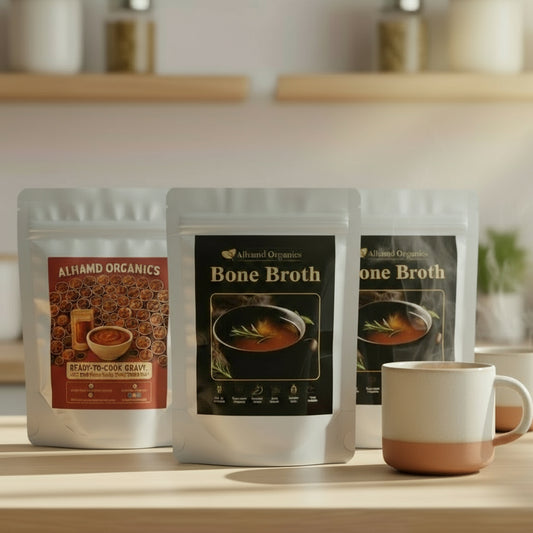 Almond Organics bone broth packages on a kitchen counter with a mug.